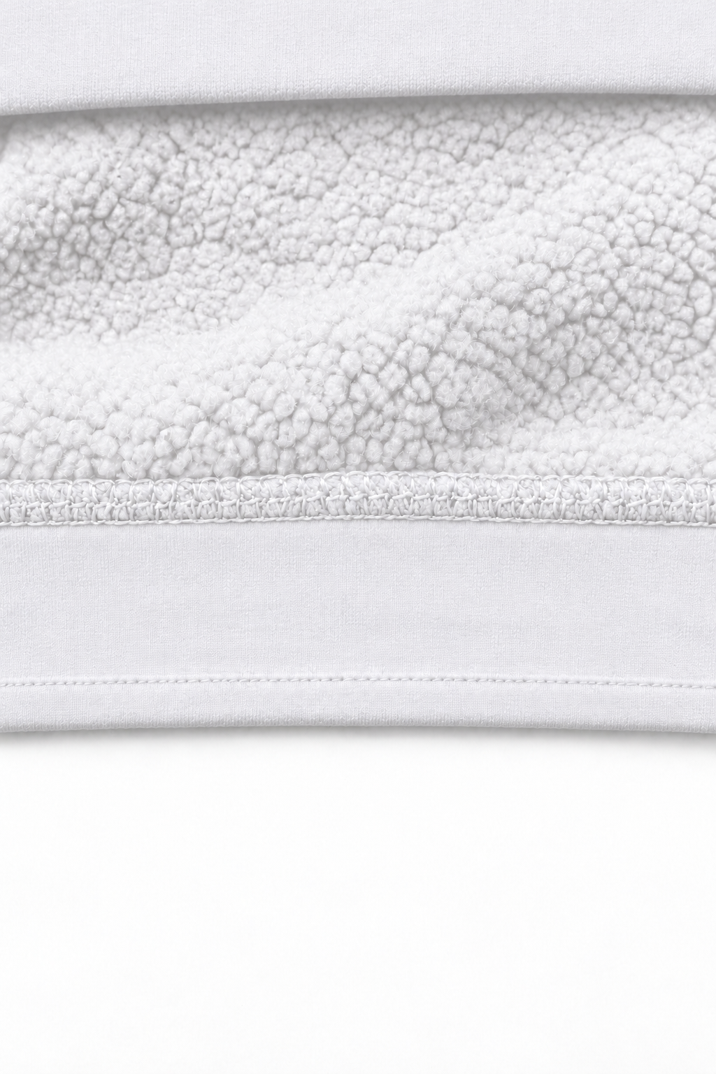 THE TRACE White — interior fleece fabric detail, smooth plain hem, no ribbing