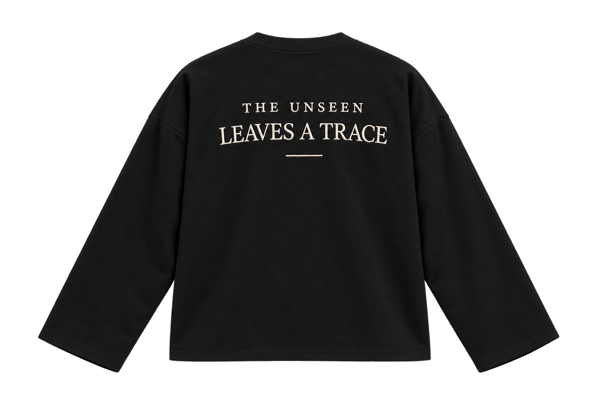 THE TRACE black — flat lay back, original embroidery, plain hems
