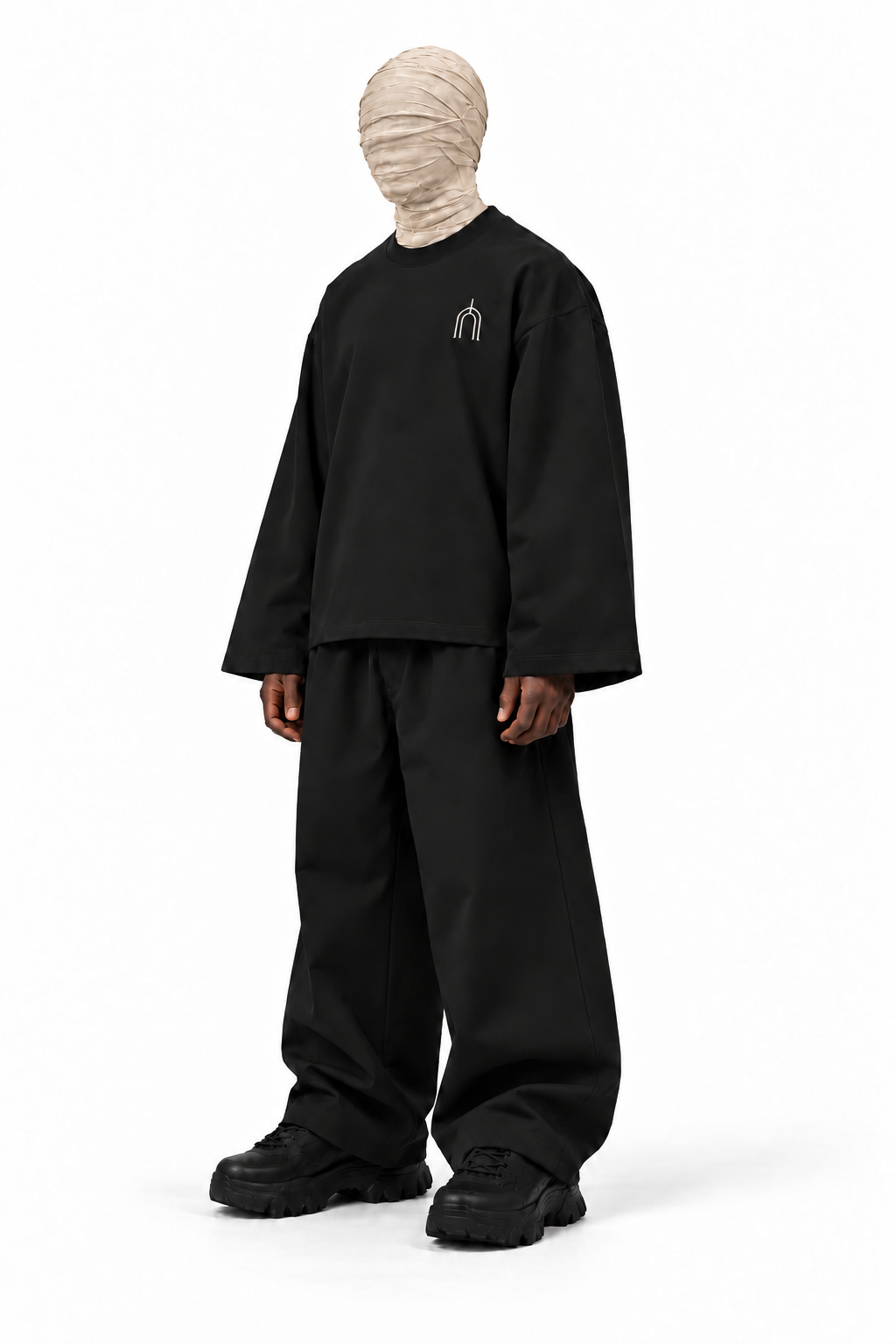 The Unseen black long sleeve — male model, angle, transparent background
