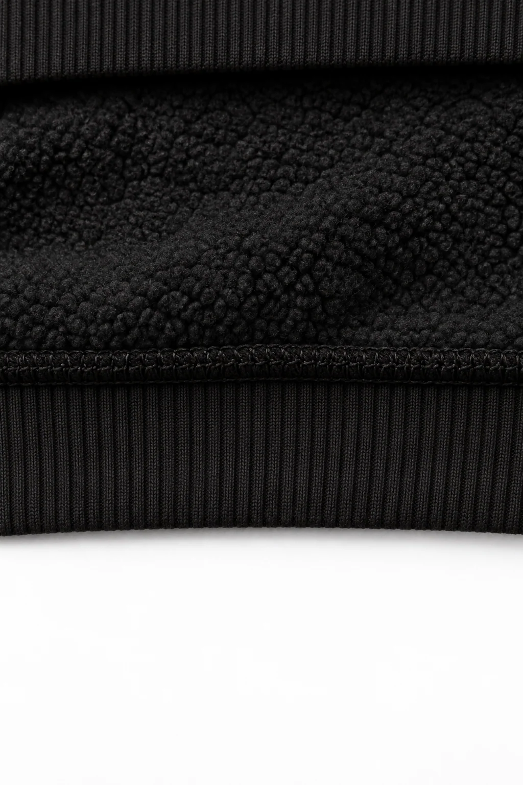 THE UNSEEN Black — interior fleece fabric detail with ribbed hoodie edges