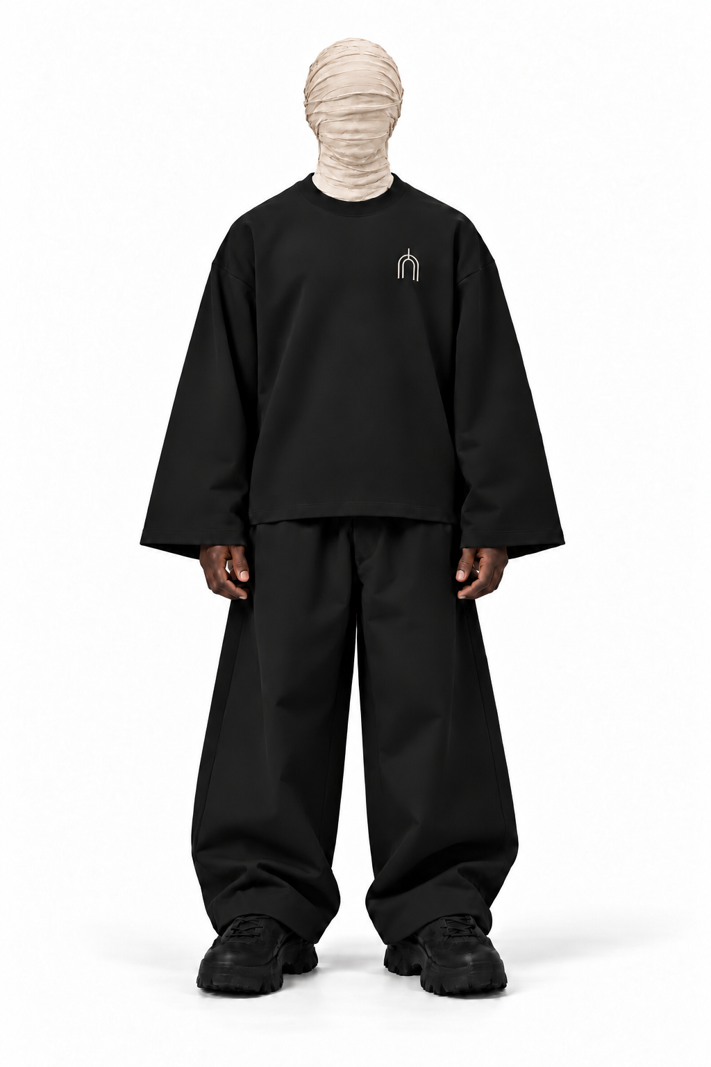 The Unseen black long sleeve — male model, front, transparent background