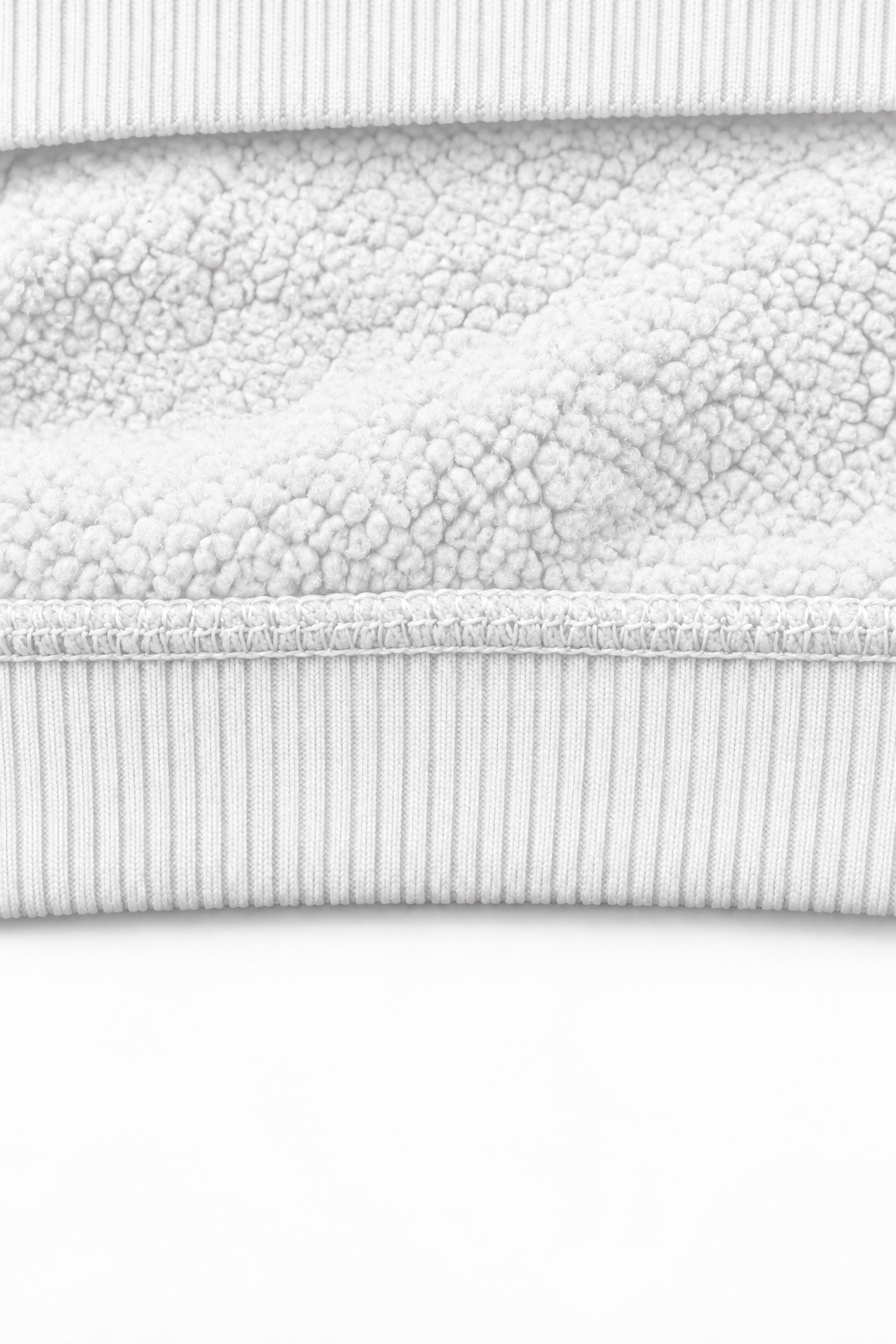THE UNSEEN White — interior fleece fabric detail with ribbed hoodie edges