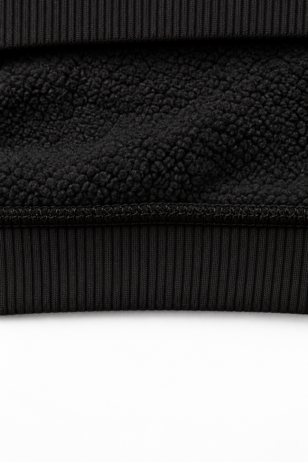 THE VEIL black — interior fleece fabric and hem detail