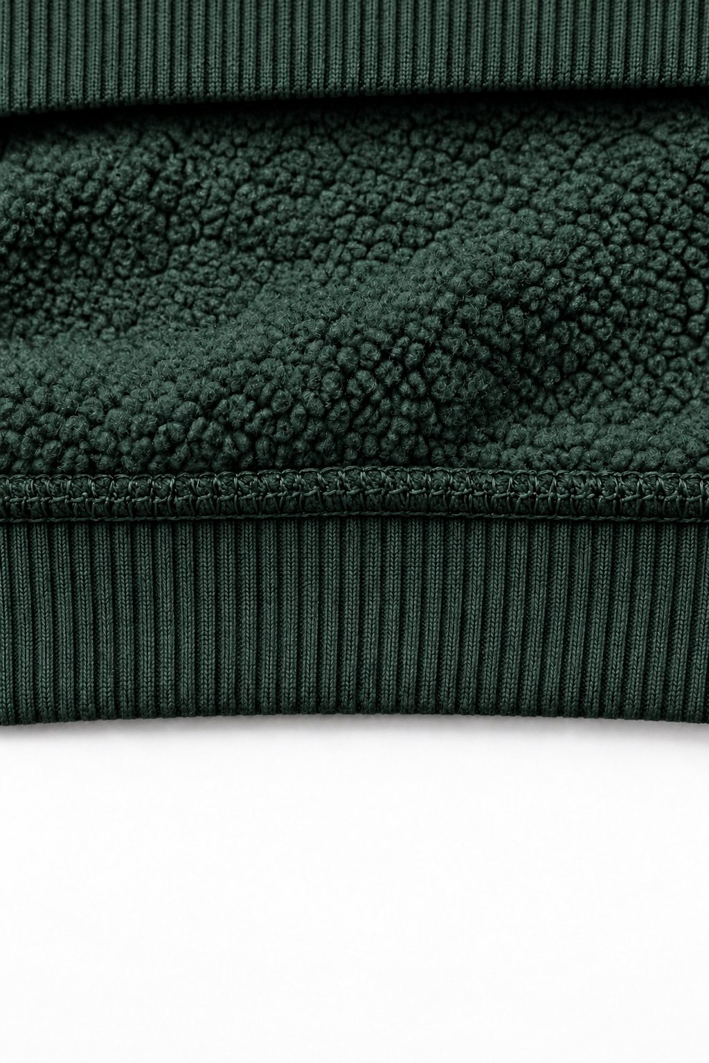 THE VEIL dark green — interior fleece fabric and hem detail